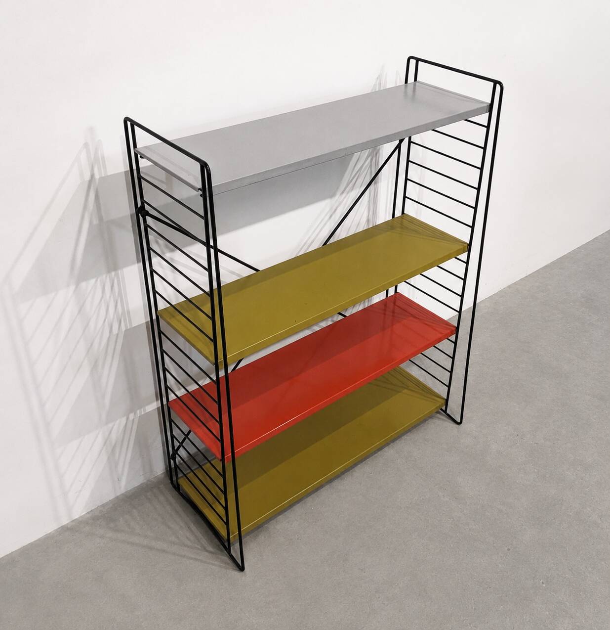 Vintage metal Tomado shelf to place