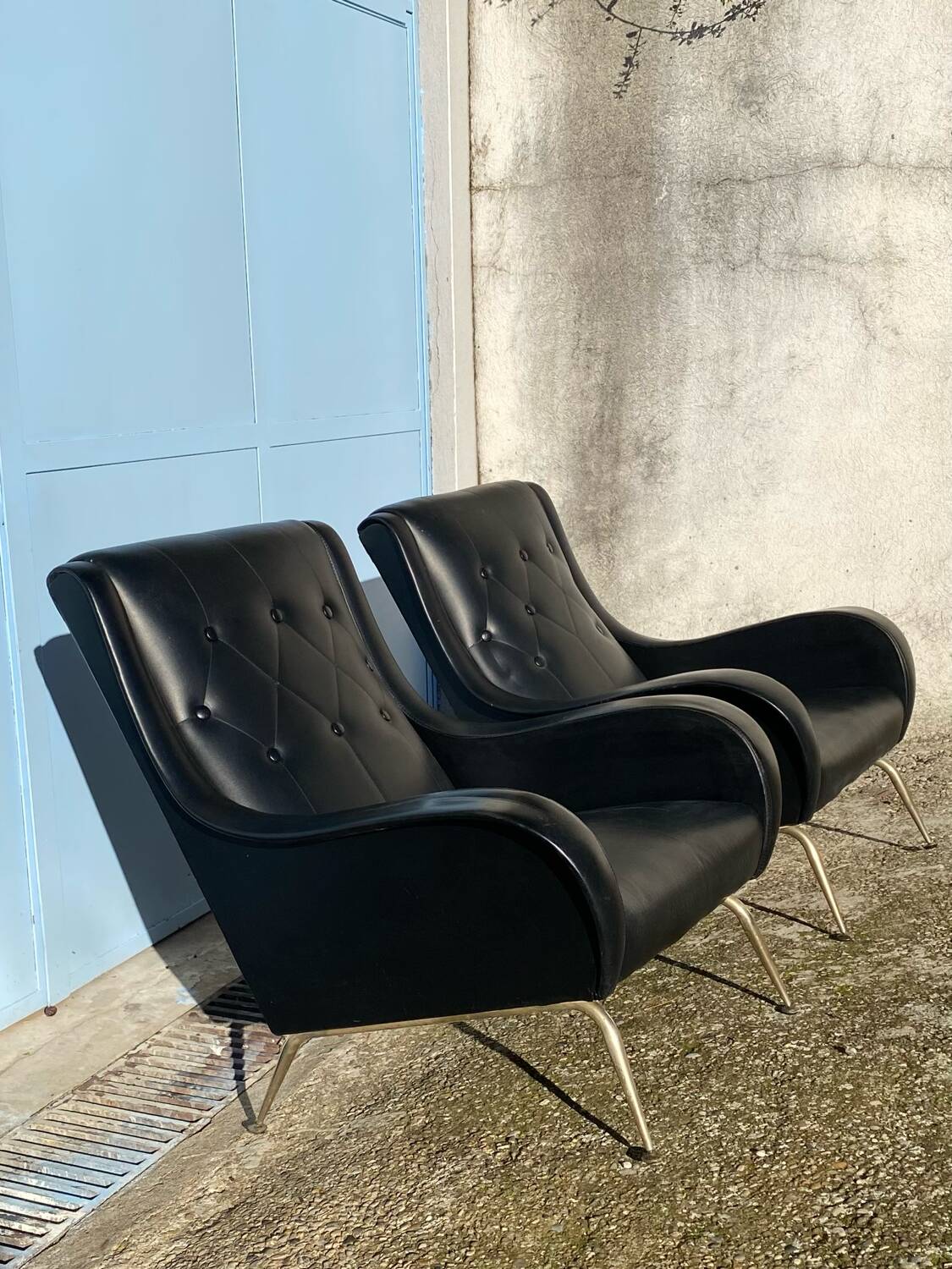 2 vintage faux leather armchairs