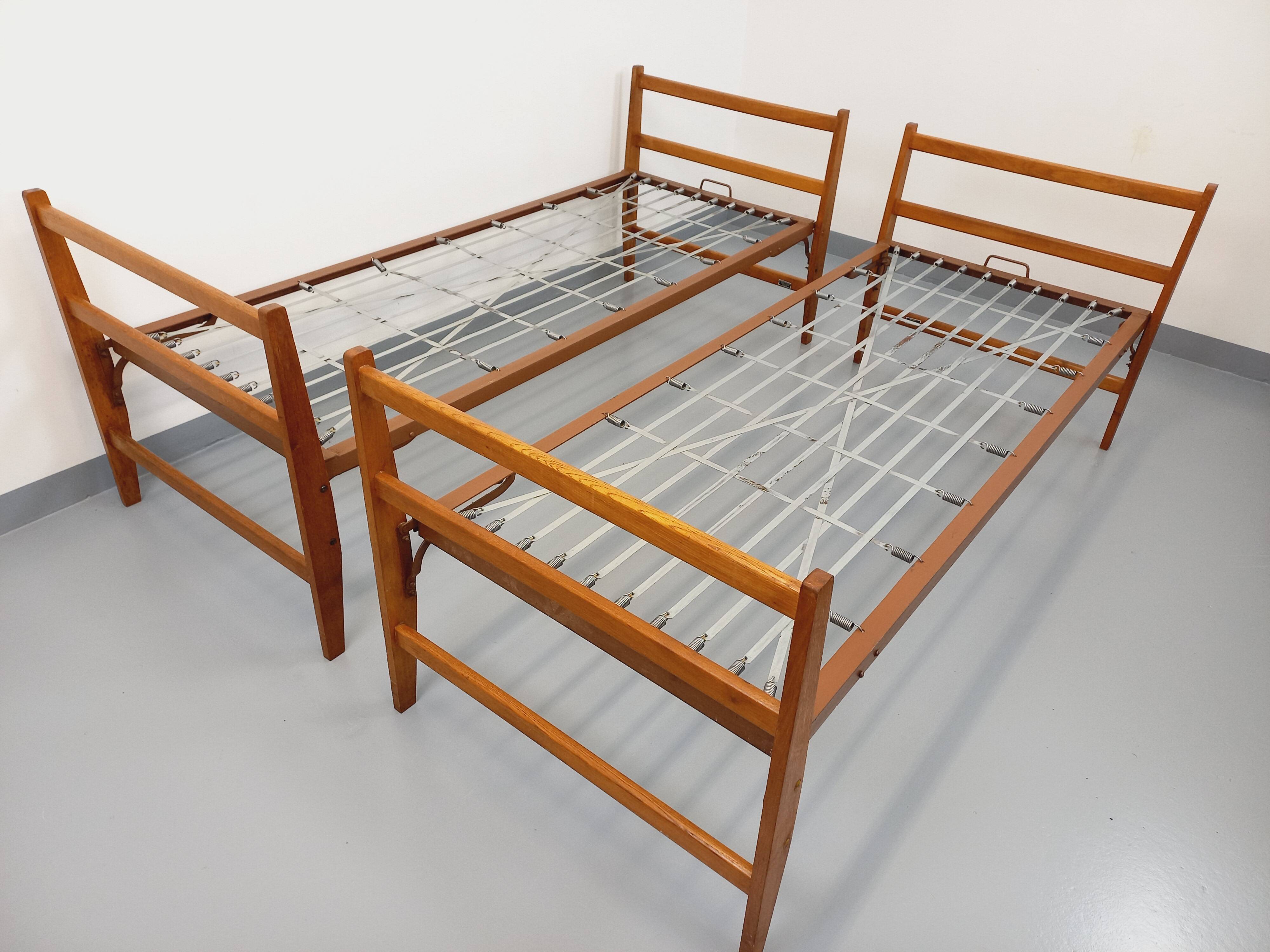 Pair of vintage stackable daybeds in oak wood and metal from the 60s