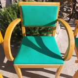 3 vintage bridge chairs with rounded armrests.