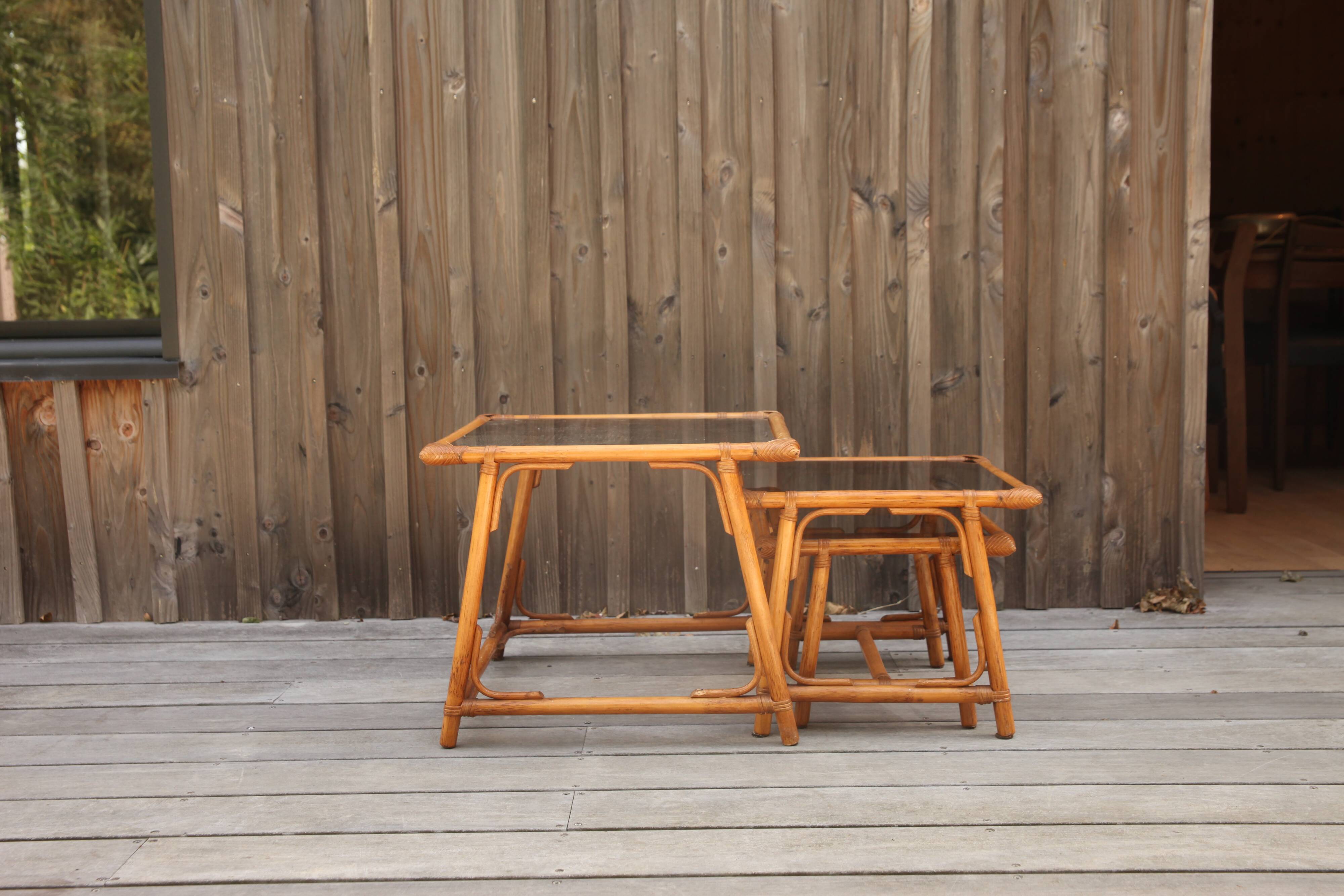 Nesting tables in rattan and glass