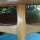 Round coffee table in solid walnut double tray of the 1970s