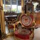 French palace mirror with bow and lion heads, gilded frame.