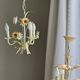 Small vintage cream metal flower chandelier with orange flowers and 3 arms.