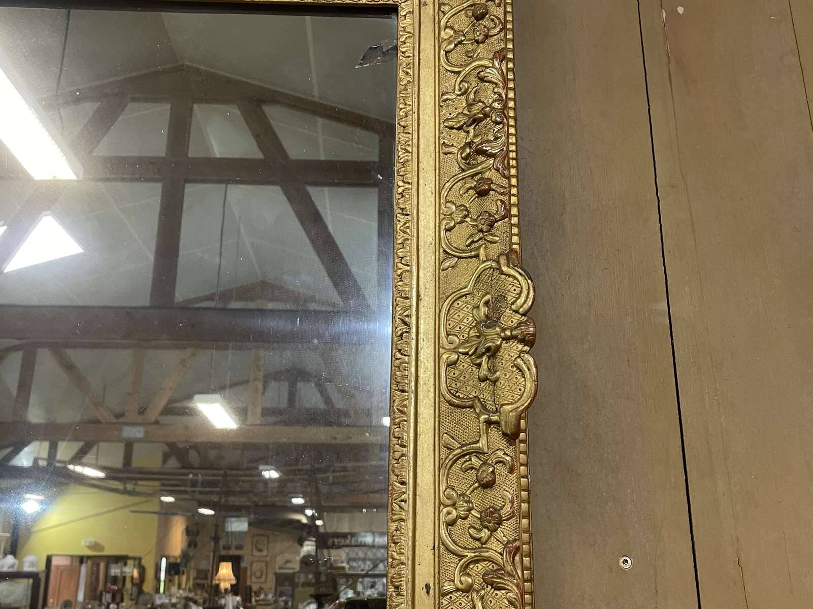 18th century Regency mirror in gilded wood