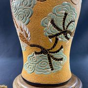 Very large dragon lamp on a yellow background in well-fired Vietnamese stoneware.
