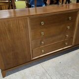 According to André Arbus, a sideboard in a row from the Art Deco period in blonde mahogany.