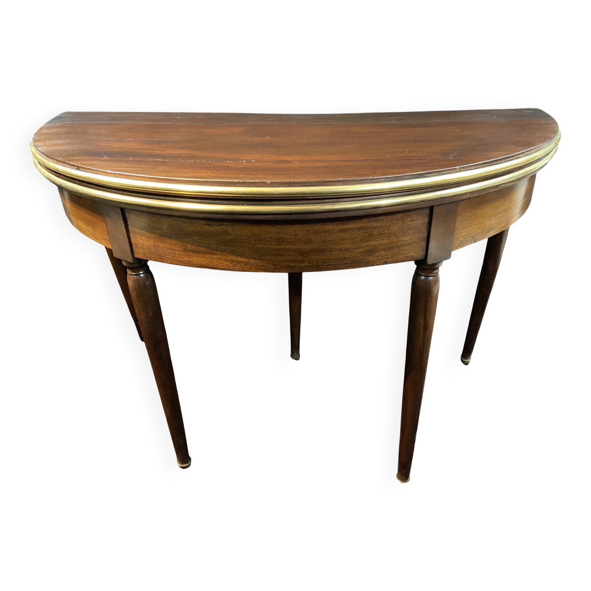 A Louis XVI period mahogany half-moon table forming a console/games table