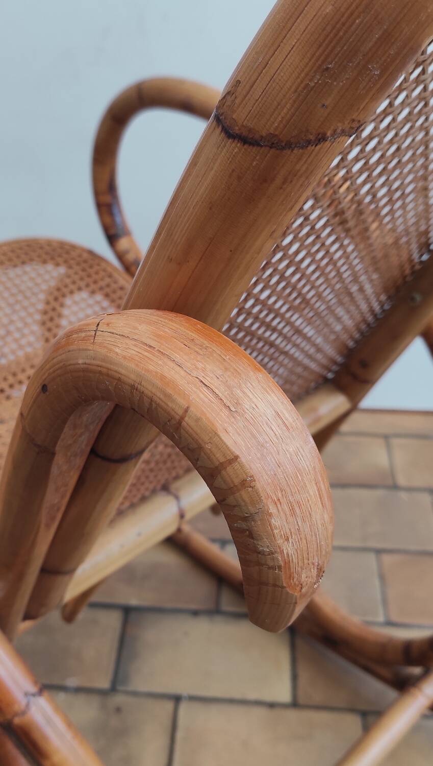 Vintage rocking chair in rattan and cane.
