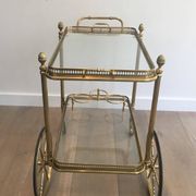 Neoclassical brass rolling table from Maison Baguès