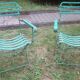 Pair of mid century distressed painted iron garden chairs