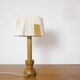 Wooden candle holder mounted as a lamp and its rope shade, 47.5cm.