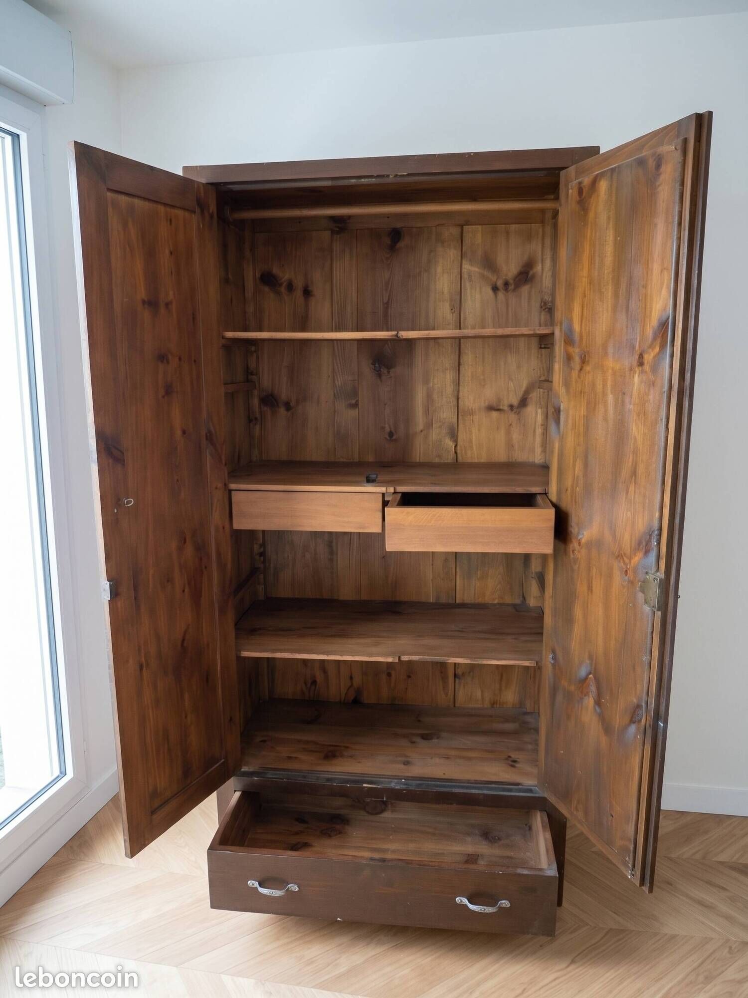 Rustic handcrafted wooden wardrobe with mirror