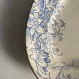 Oval blue presentation plate with birds.