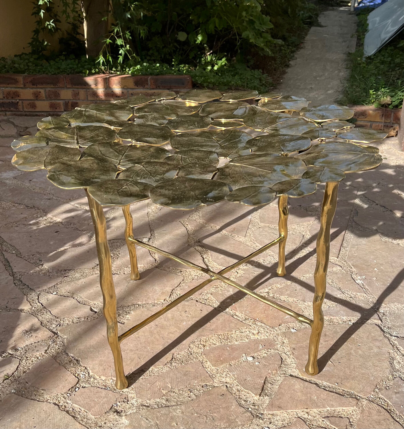 Carved brass coffee table with ginkgo decor