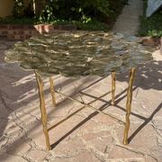 Carved brass coffee table with ginkgo decor