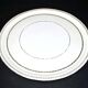 Limoges porcelain pie dish with gold trim, 32cm.