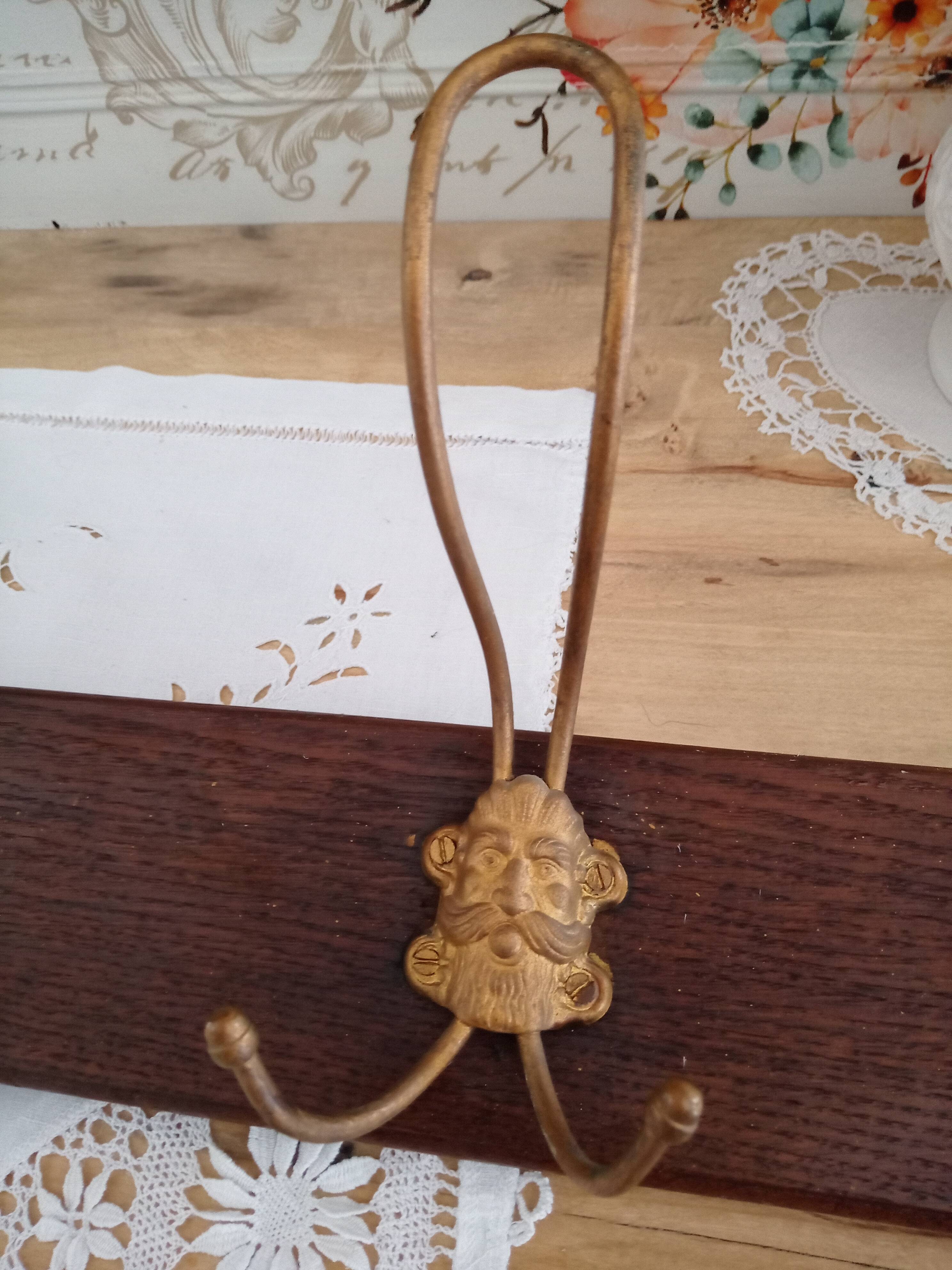 Wall coat rack 6 brass patères form mascarons
