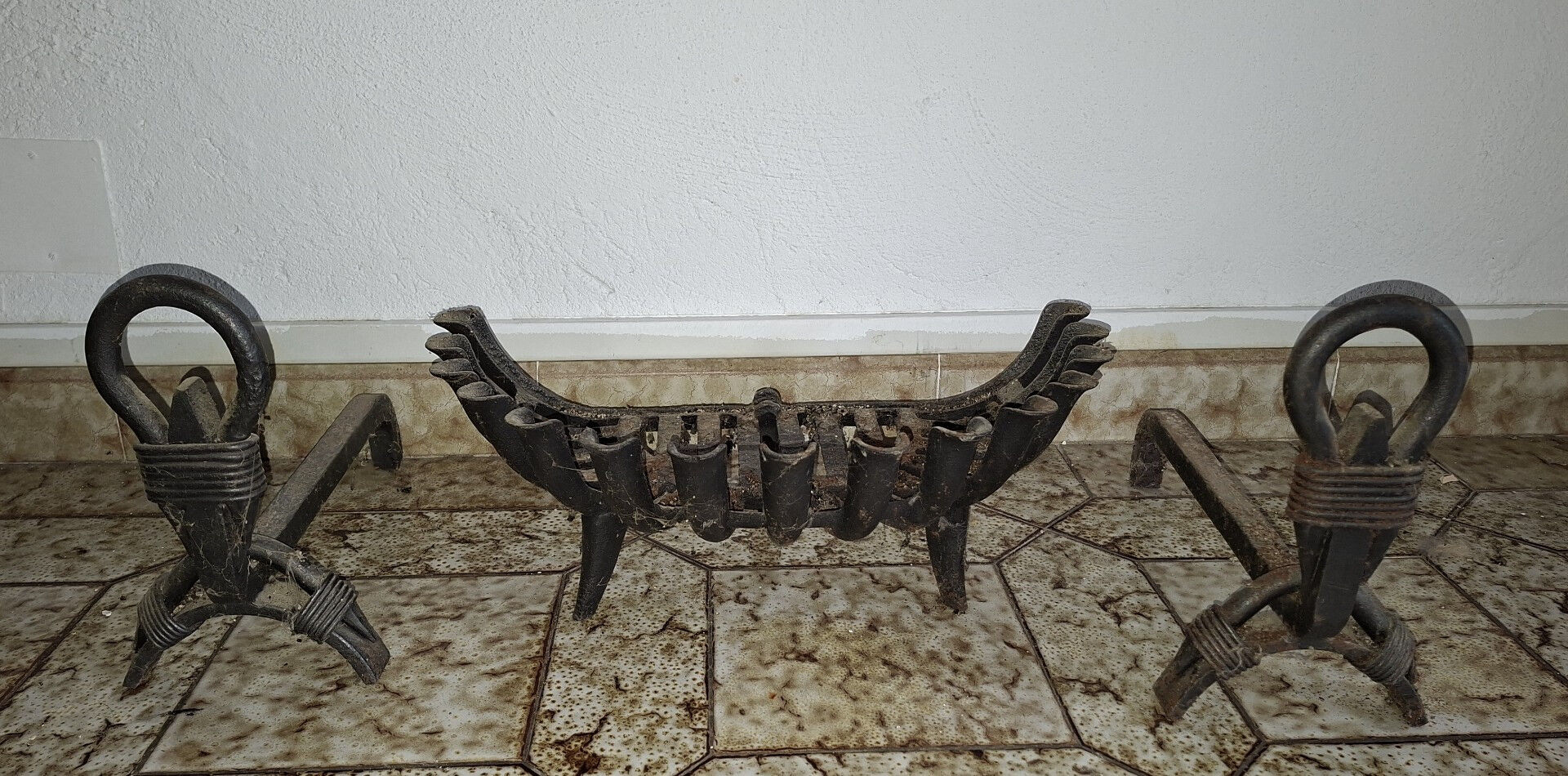 Important wrought iron fireplace accessories – Andirons and log basket
