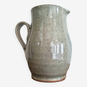 Old pitcher in gray glazed sandstone and flowers