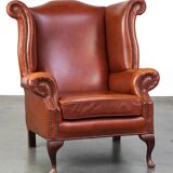 Elegant, smooth, and comfortable English Chesterfield wingback armchair in a beautiful classic color