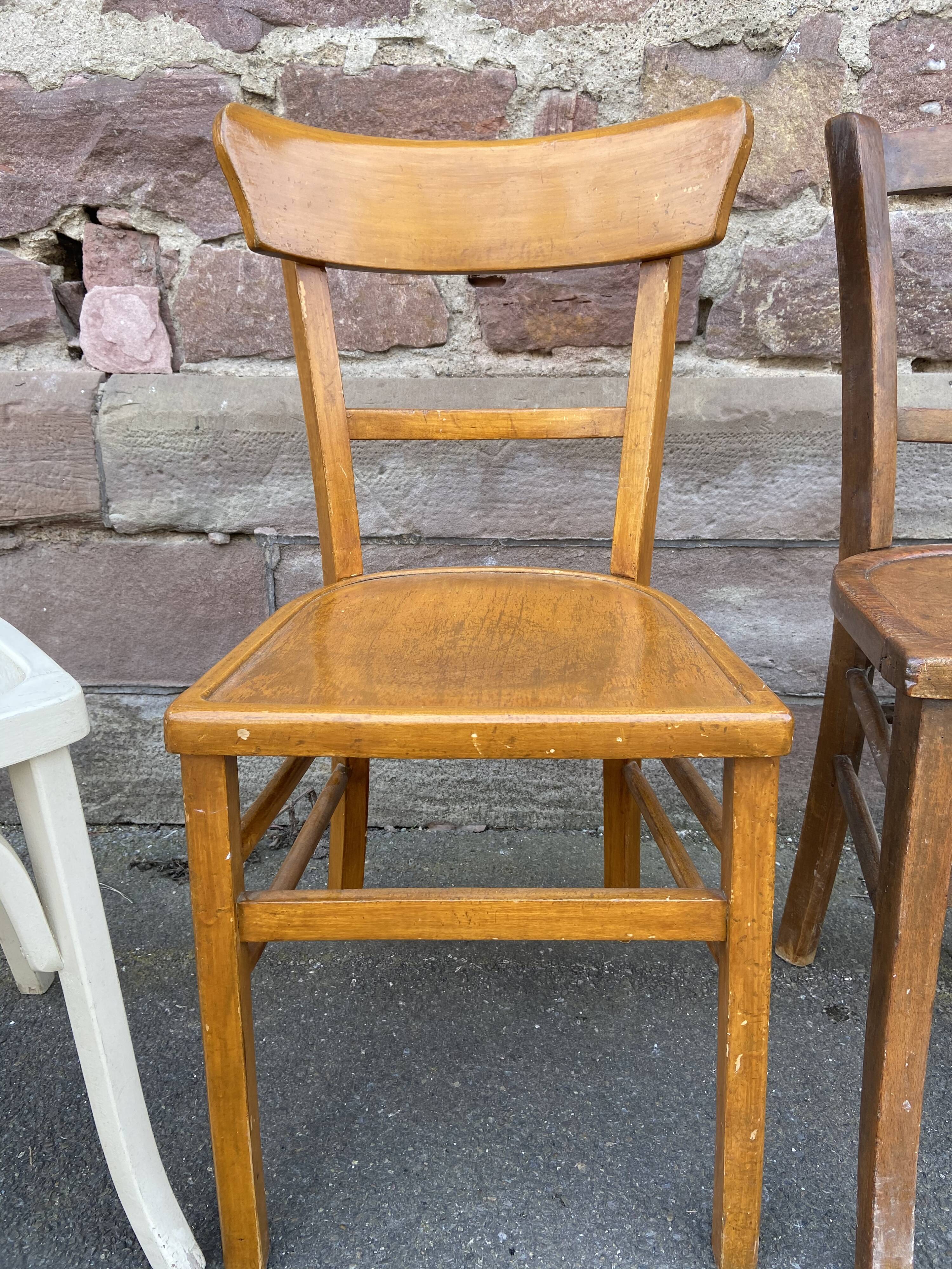 4 mismatched curved wooden bistro chairs