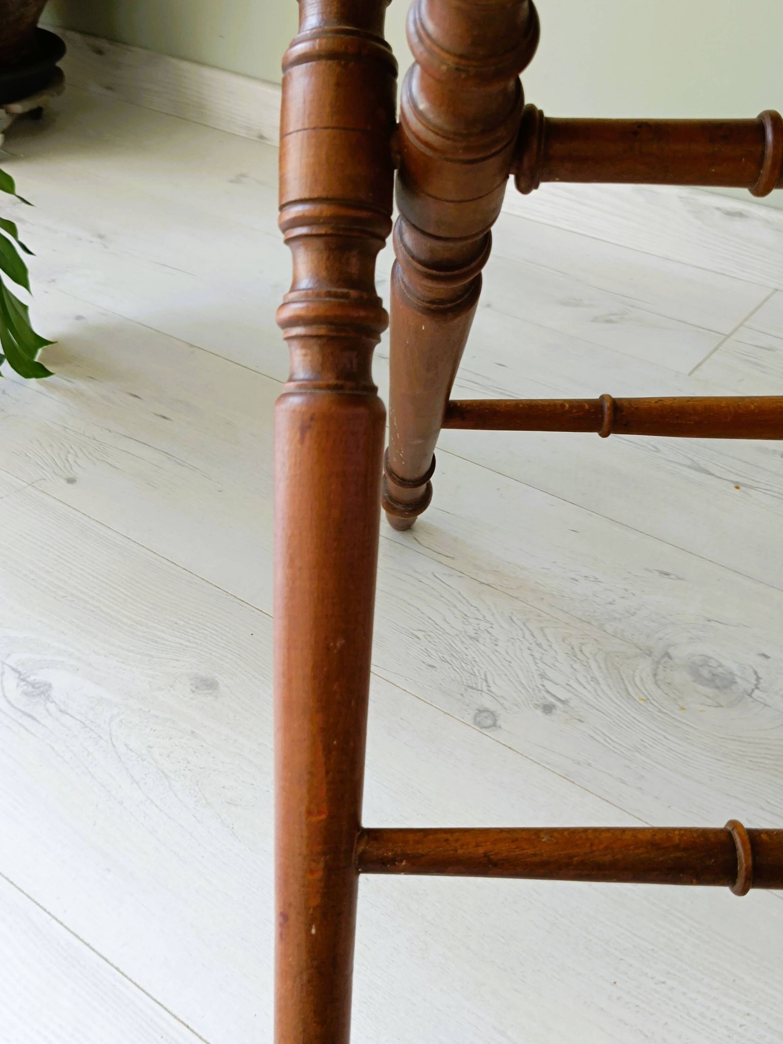Vintage folding table with turned legs.