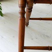 Vintage folding table with turned legs.