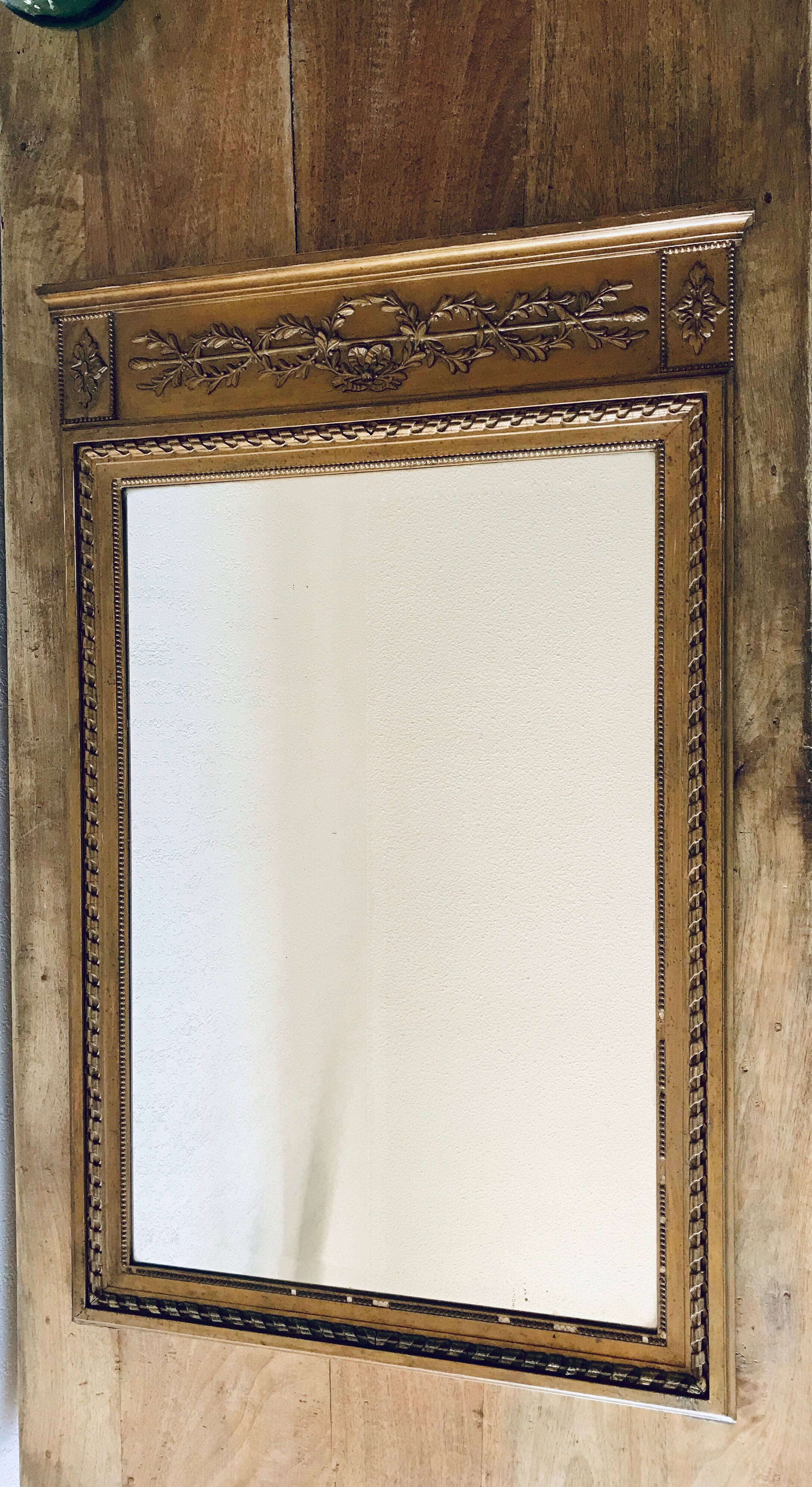 Gilded and beveled pier mirror 88x58cm