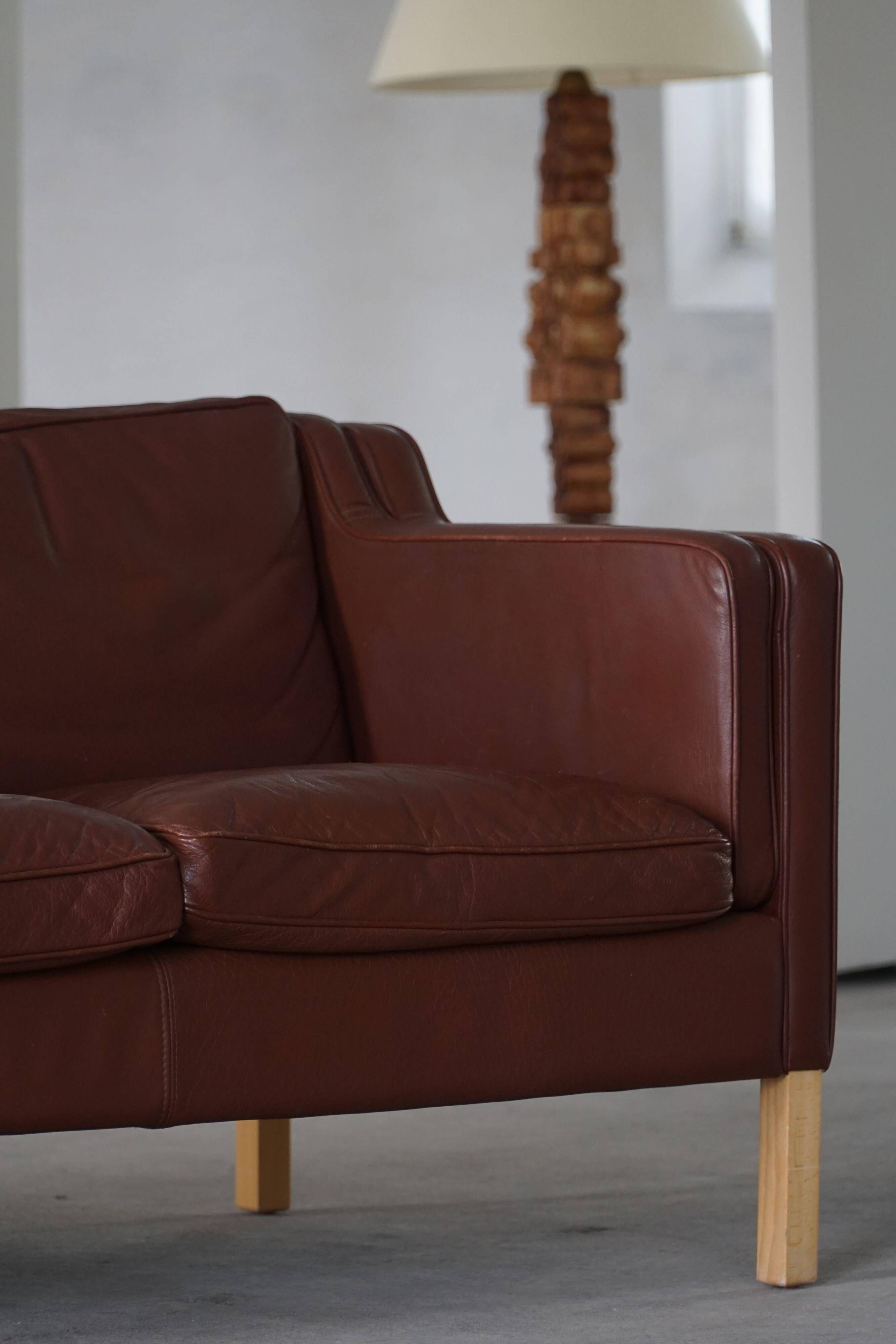 Stouby Møbelfabrik, two-seater sofa in mid-century style in brown leather, 1970s.