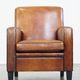 Art Deco design sheepskin leather armchair with a stunning patina