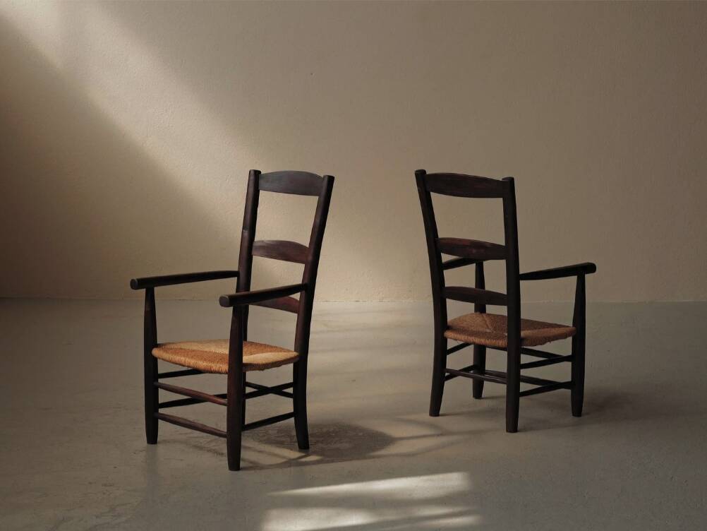 Pair of solid wood and straw armchairs, France, circa 1950.