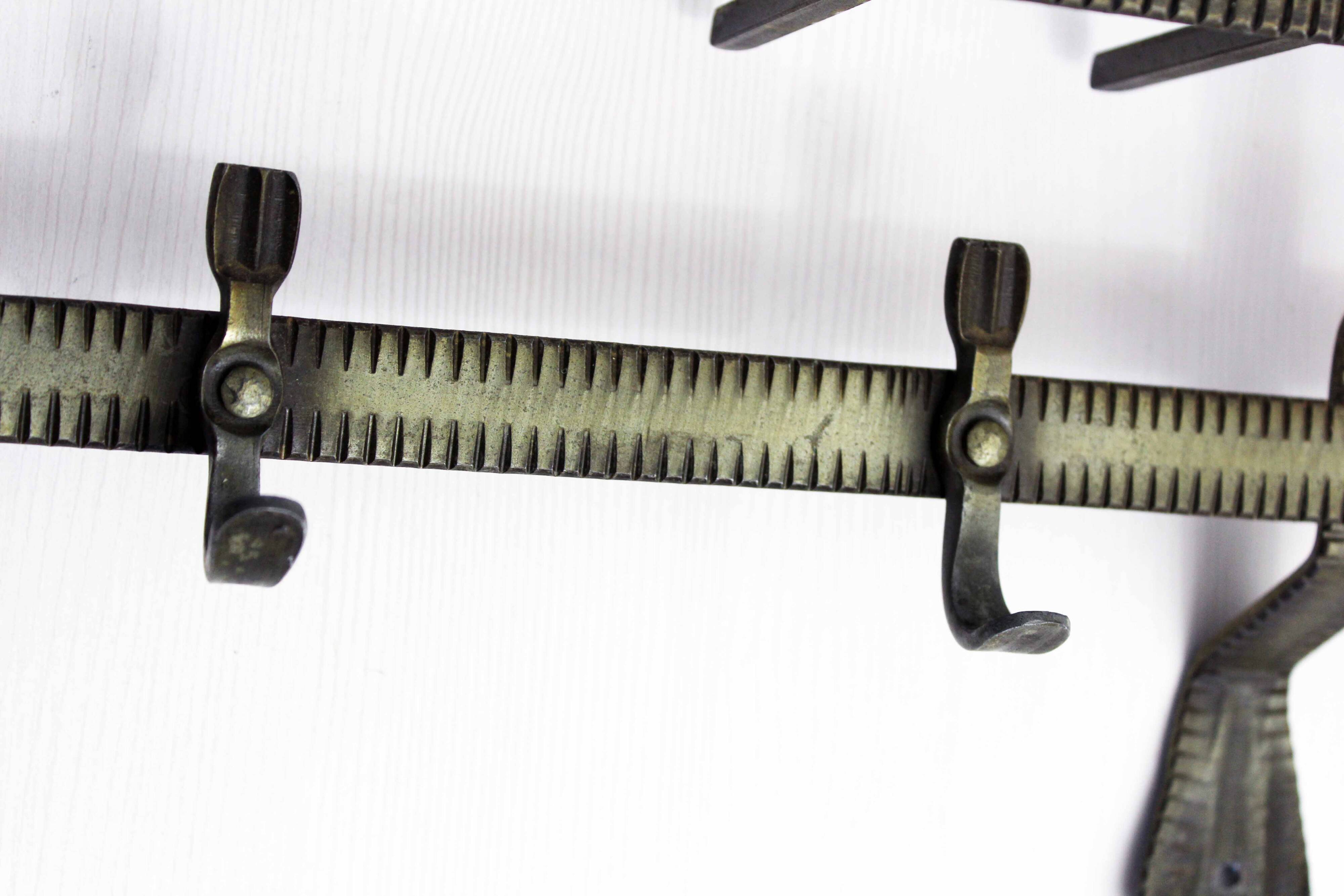 Metal wall coat rack