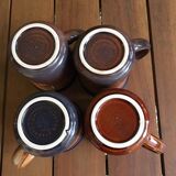 4 cups of the brand Staffordshire in porcelain. Two different colors.