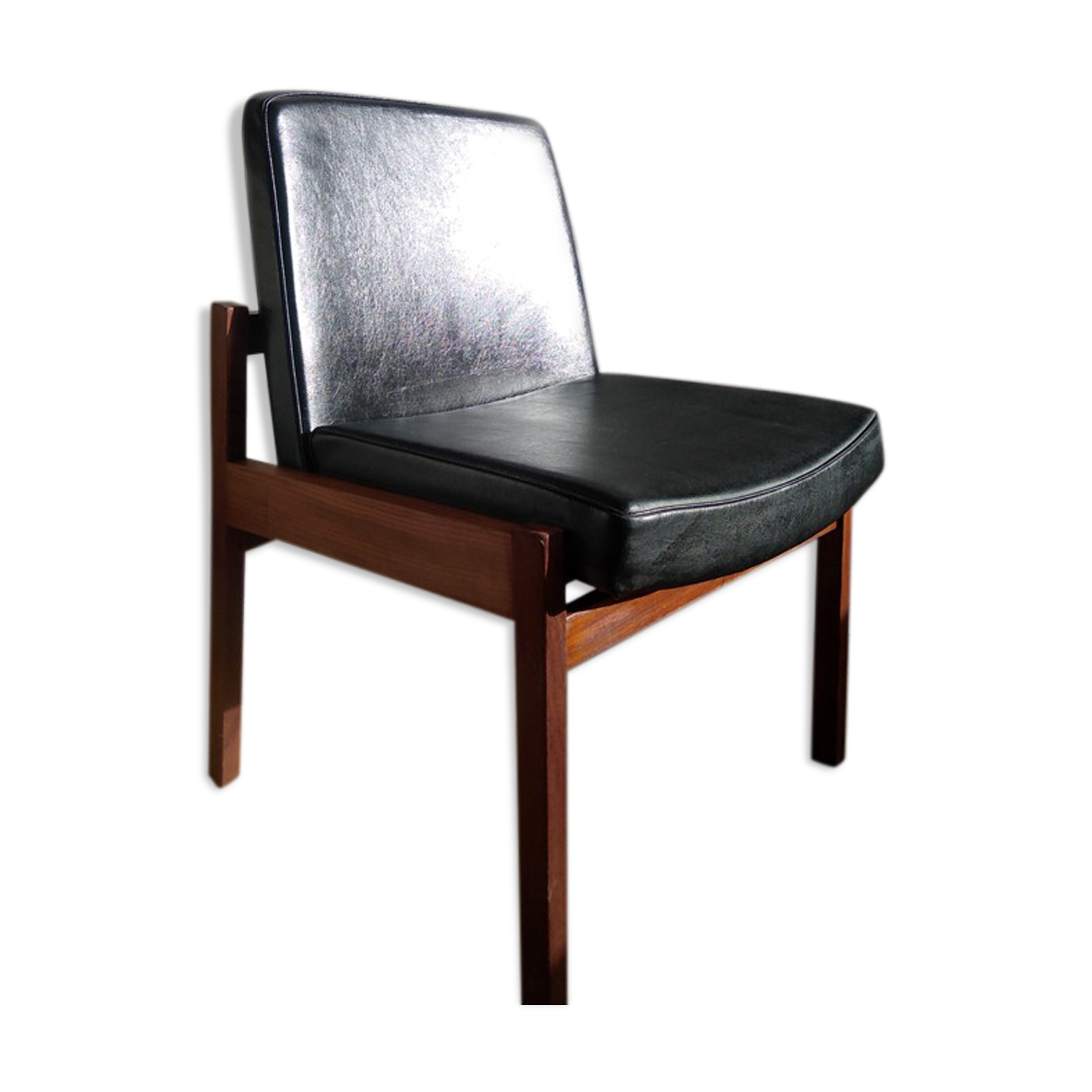 Massive teak and black skai armchair from the 1960s
