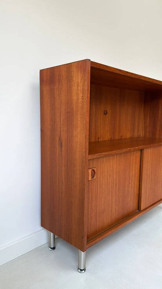 Vintage wooden cabinet with sliding doors
