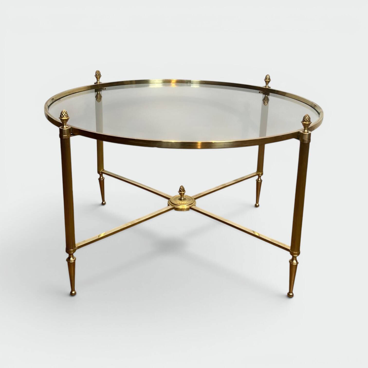 Neoclassical Round Coffee Table in Brass with Fluted Supports and Floral Motifs