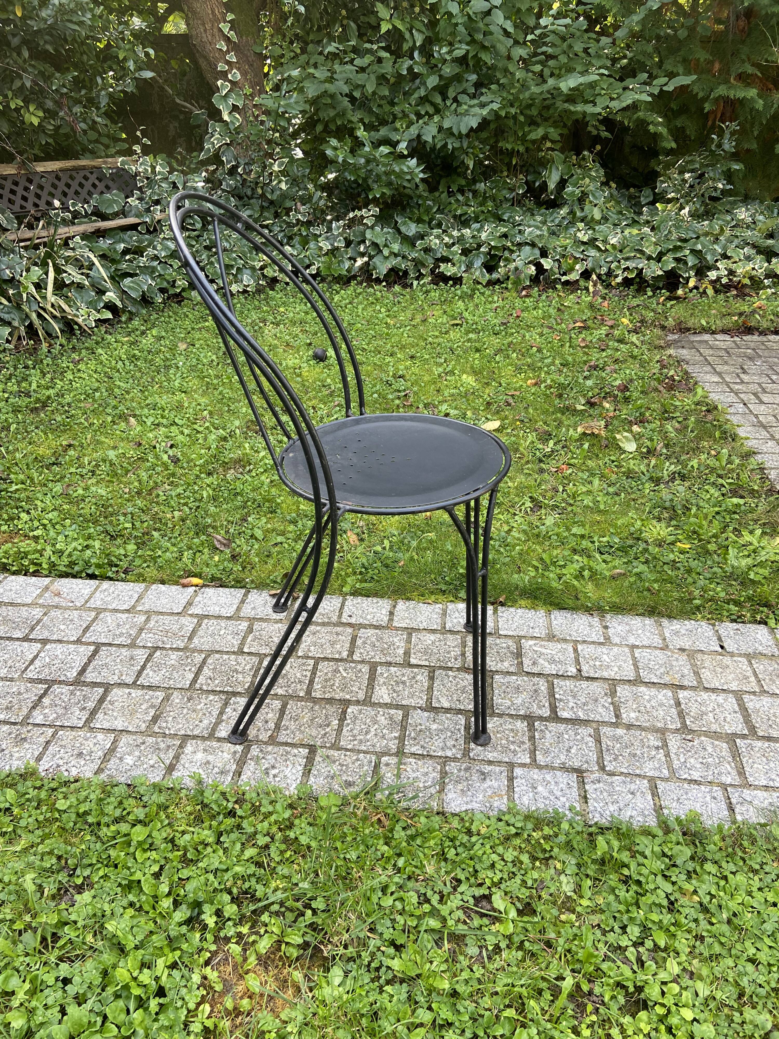 Black chair in vintage wrought iron 1980