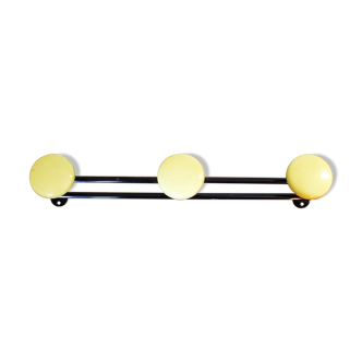 Coat 60 years yellow metal door