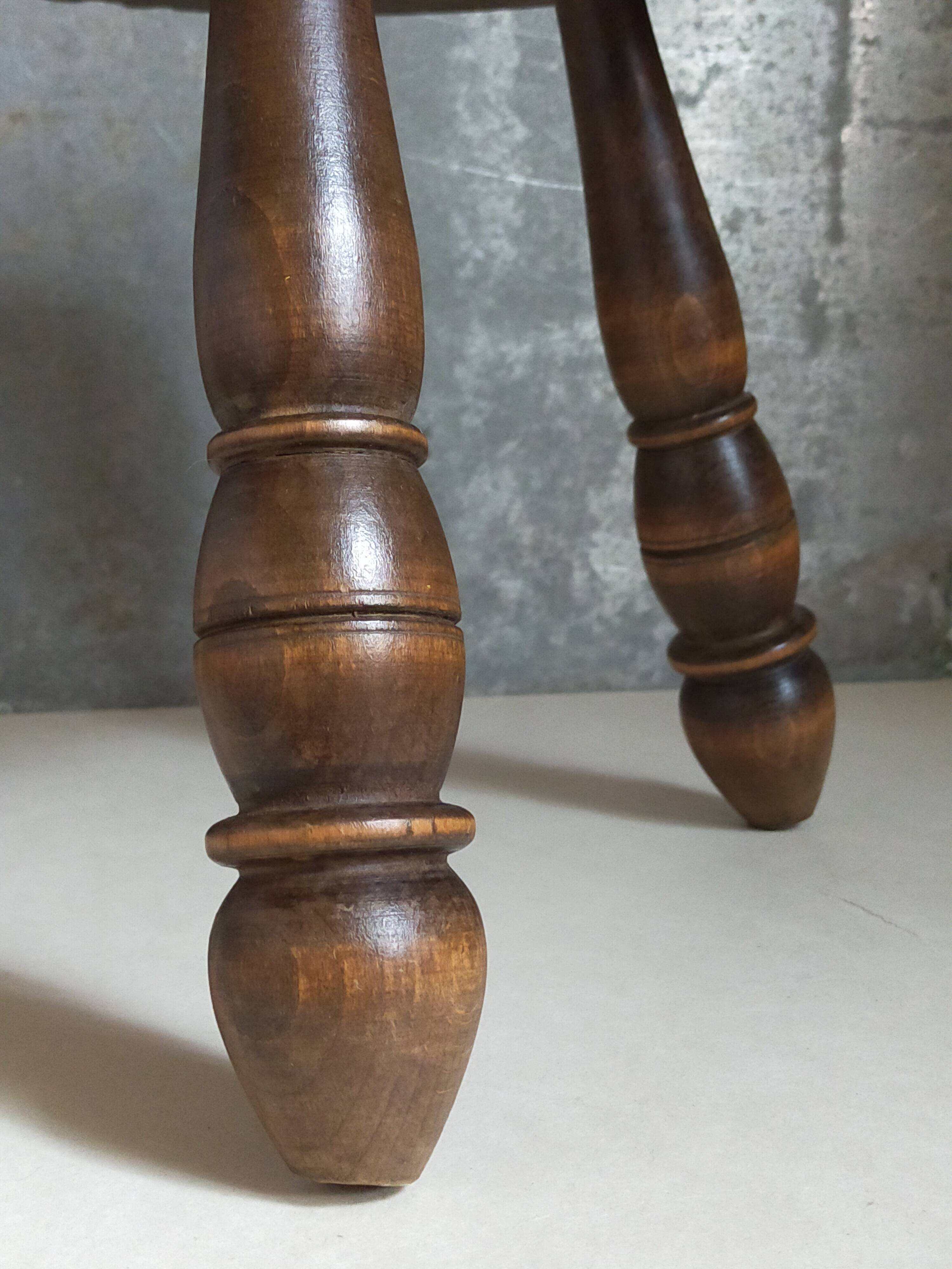 Low tripod stool in vintage turned solid wood