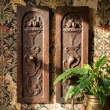 Pair of decorative wall panels in carved wood from the 19th century.