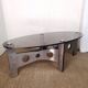 Table basse design vintage en alu brossé et plateau de verre.