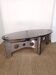Table basse design vintage en alu brossé et plateau de verre.