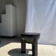 Black mango wood tripod side table with a semi-spherical top, height: 45 cm, diameter: 44 cm.