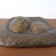 German bronze relief of mother with baby, 1940s.