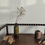 Natural wood chest forming a bench, ringed shoulders