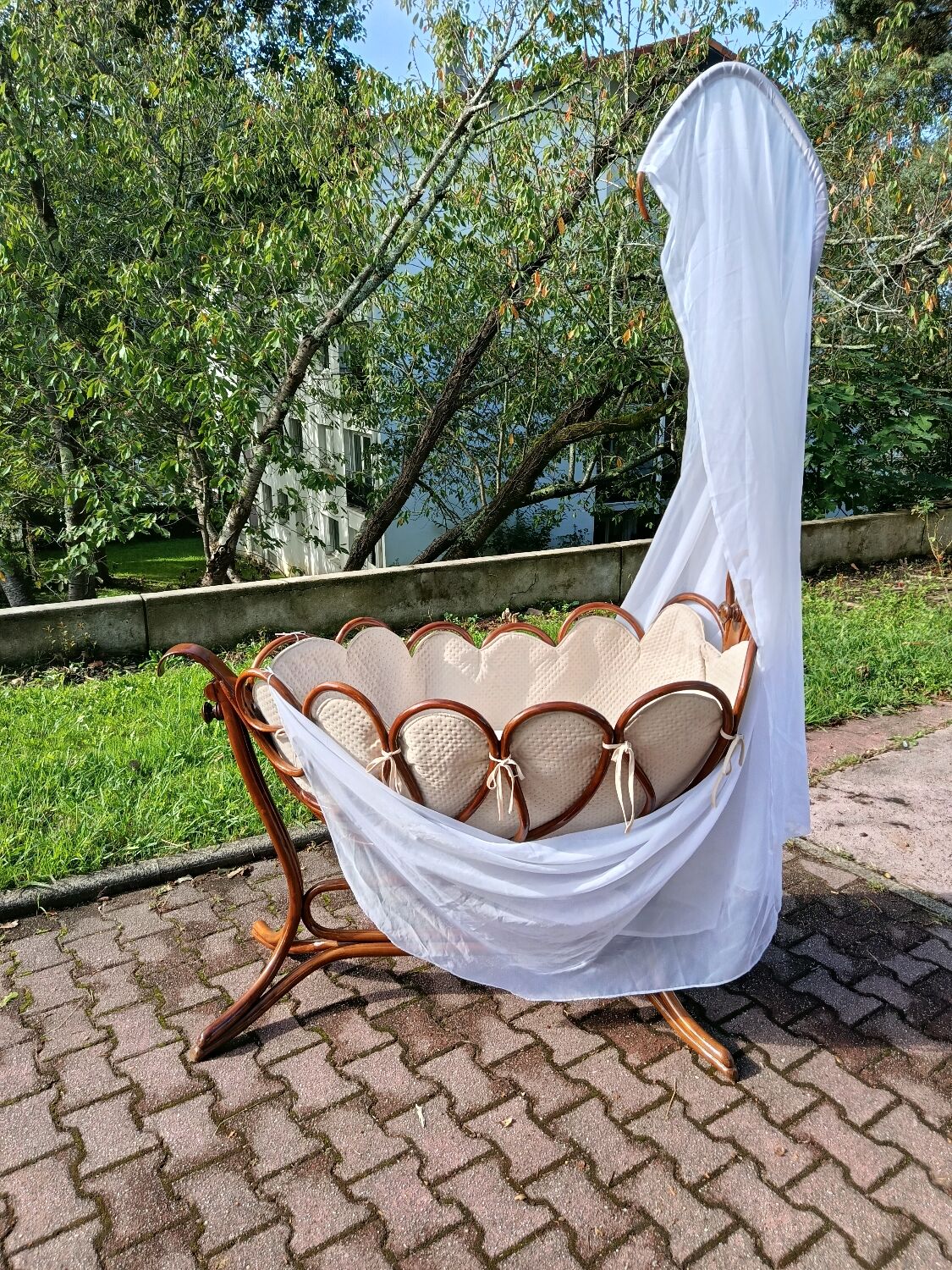 Antique cradle by J&J Khon