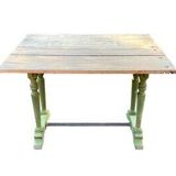 Old table with patinated green legs