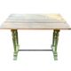 Old table with patinated green legs