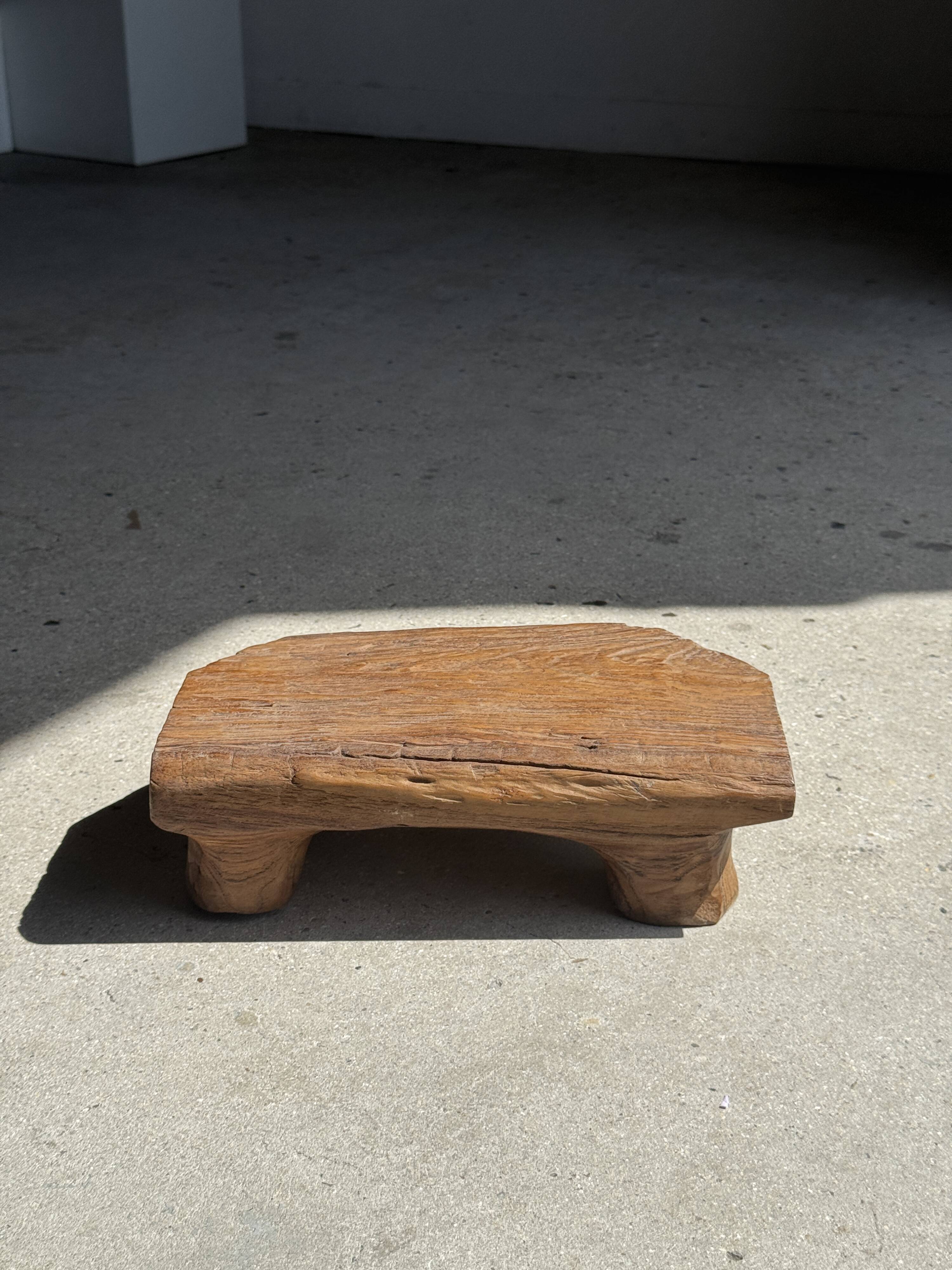Small stool, teak footrest with short cut corners.
